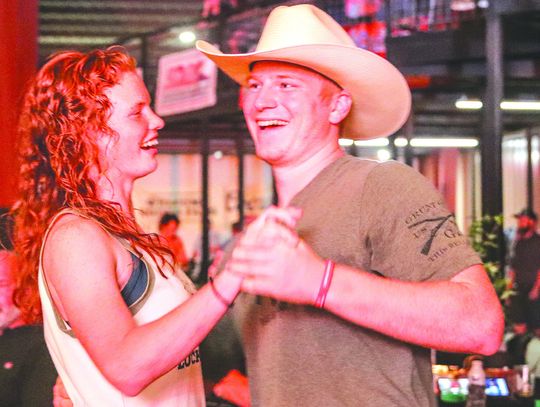 Adrianna Briggs and Khris Kassner of Burnet two-stepped Sept. 21 at Putters &amp; Gutters of Marble Falls during Weakday Ministries fundraiser. Find more photos Inside. Photos by Martelle Luedecke/Luedecke Photography