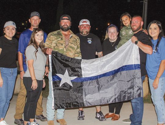 During Project 316, Bailey Rodgers, Jeremy Stewart, Tiffany Clark, Mike Ryan, Mia Meza (daughter of the late Burnet Police Officer Jose Meza), Jason Coates, Mariela Silva, and Carla Meadows held a blue-line Texas flag for their photo Saturday Oct. 5 at Haley Nelson Park. Find more photos o...