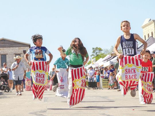 Clint Thompson led his heat of the sack race April 12 during the Children’s activities of the Bluebonnet Festival. Find more photos on Pages 12 and 14. Photos by Martelle Luedecke/Luedecke Photography