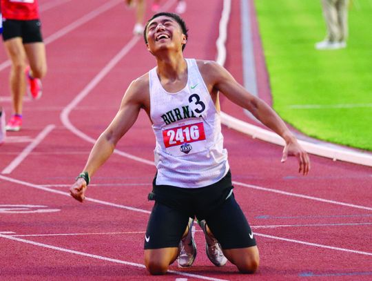 Victor Aviles soaks in the moment after winning the 1,600 meters at the Class 4A State Track Meet in Austin May 1 to cap off an incredible day that included a gold medal in the 800 meters and silver in the 3,200 meters. Photos by Martelle Luedecke/Luedecke Photography