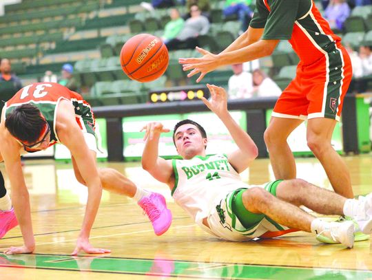 Marcus Pimentel shows some Bulldog hustle securing a loose ball and finding a teammate with a pass from his back.