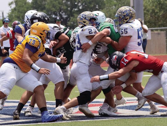 Burnet defensive end Noah Billock meets Kerrville Tivy running back Domynik Vasques at the line and pushes him back. Photos by Jennifer Fierro/TexasChalkTalk.com