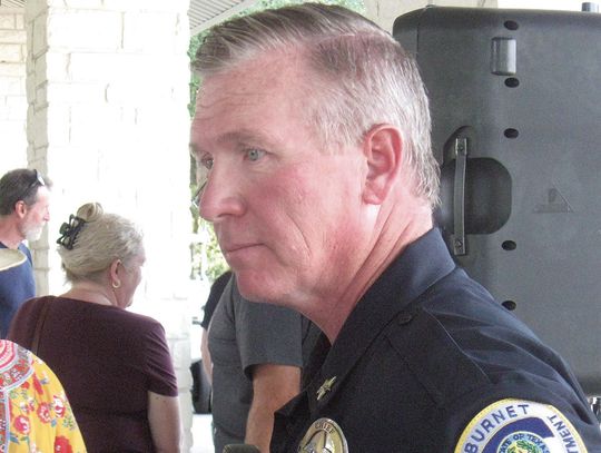 Burnet Police Chief Brian Lee chatted with one Burnet resident during the recent meeting at the Delaware Springs Golf Course. Photo by Raymond V. Whelan