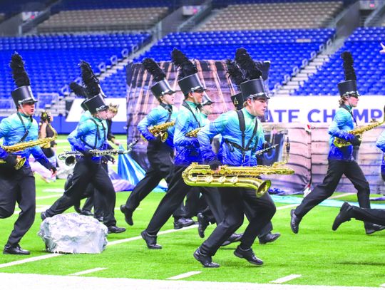 Burnet Esprit de Corps saxophonists Gideon Robles, Kendall Koschtial, Mackenzie Green, Zane Hubbard, Peyton Villarreal, and Reilly Gerdes ran to the ship in their A Wave of Sirens performance Nov. 13 for UIL State Marching competition held at the Alamodome. Photos by Martelle Luedecke/Lued...