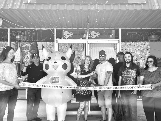 From left, Burnet Chamber Executive Director Allison McKee, Juan Medina, ‘Pikachu’, owners Mandy and Blake Lowry, David Ramon, Dale Nuttall and Gloria Flores helped re-open the Itsy-Bit Arcade May 8 at its new location on Burnet square,124 S Main St. Contributed photos