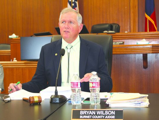 Burnet County Judge Bryan Wilson, pictured here reciting a resolution to oppose a rock quarry, presided over the May 13 commissioners court meeting. Raymond V. Whelan/Bulletin