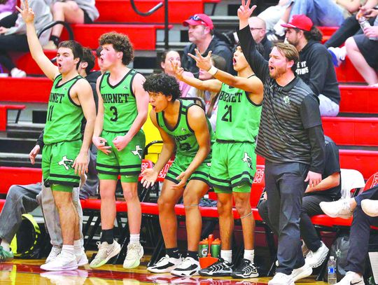 Photos by Wayne Craig/ Clear Memories The Bulldog bench goes wild as teammate Benito Bocanegra hits one of his five three pointers. Bocanegra and his Bulldog teammates collected a big win at Salado.