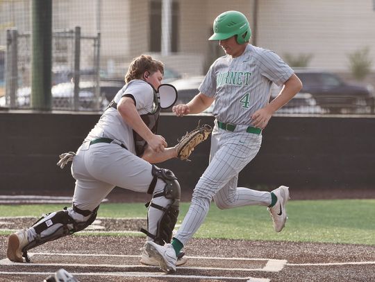 Trey Morrow steps on home for a Bulldog run to make it 3-1 on Friday versus Taylor. The play was close, but the Ducks catcher tagged with the glove while the ball rested in his other hand. Photos by Wayne Craig/Clear Memories