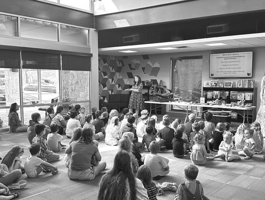 Dinosaur historian educates library youth