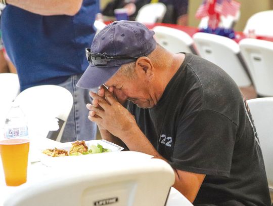 Marcos Torres bowed his head in prayer in the Vanderveer Street Church of Christ dining hall during the Burnet DIVAS and BROS veterans dinner served Nov. 14. Find more photos on Page 8. Photos by Martelle Luedecke/Luedecke Photography