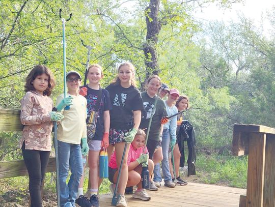 Girl Scouts clean flood-damaged areas