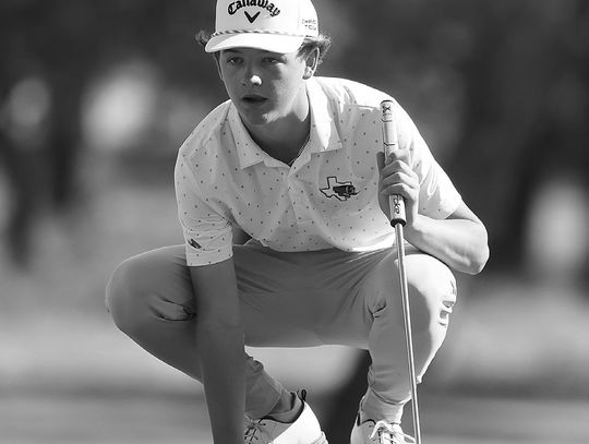 While placing his ball on the green Hays Bennett gets down to study the lie. Bennett finished the hole with a birdie and shot a team best 84. Photos by Wayne Craig/Clear Memories