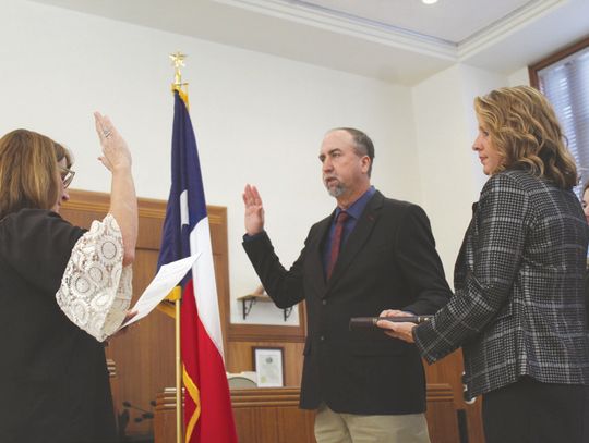 From left, Pct. 2 Justice of the Peace Lisa Whitehead provided the oath protocol for newly elected Pct. 3 Burnet County Commissioner Chad Collier next to his wife Lyndy and son Case. Raymond V. Whelan/Bulletin