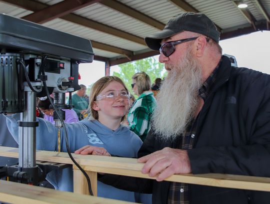 Each year, the Burnet Rotary Club plays a big part in the bed build operation, hosted by Sleep in Heavenly Peace. Pictured is Addy Parker and Chris Parker at the bed build last spring at Wallace Riddell Park. File photo