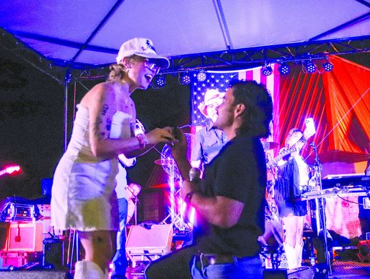 Photos by Martelle Luedecke/Luedecke Photography On Saturday July 6, during the Jackson Street Jams Bellamy Brothers concert, Burnet resident Parker Robertson got down on one knee and proposed to Kenze Jones.