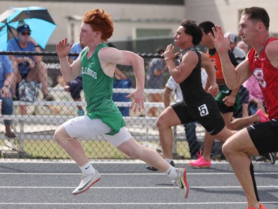 Varsity Bulldog, Braxton Ringstaff, sprints past some competitors in the boys’ 100 meter dash. Ringstaff took fourth place overall earning four points for his team.