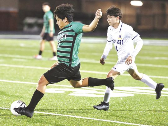 Burnet junior, Samuel Rodriguez gets some separation from a Lago Vista defender and sends the ball downfield for Burnet. The Bulldogs won the match, 5-1.