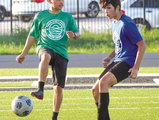 Soccer team uses summer to help themselves, neighbors