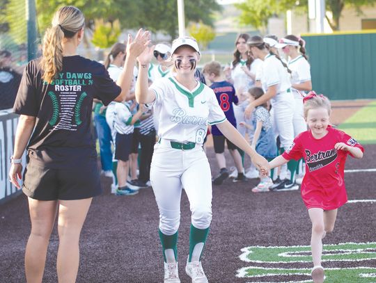 Lady Dawg Halle Maxwell and a Bertram Little League player high fived Coach Ali Tippie at Burnet High School senior softball night April 15. Find more photos on Page 7. Martelle Ludecke/Luedecke Photography