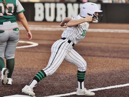 Varsity Lady Dawg Halle Maxwell celebrates a hard hit triple in the bottom of the seventh with her coach and teammates. The hit was oh so close to a walk off homerun versus state ranked Gateway but fell just shy. Photos by Wayne Craig/Clear Memories