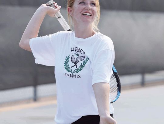 Lady Bulldog tennis athlete, Alex Burns, offers up service with a smile during a recent match. Burnet tennis will host CameronYoe on Thursday for their third district match. Photos by Wayne Craig/Clear Memories