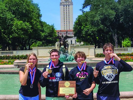 Wrigley Mulhollan, Alex Davis, Braven Briant and Maddox Briant for the iconic gold championship photo in front of the University of Texas Tower.