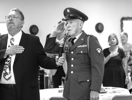 With his hand over his heart, Steve Leftwich held the microphone as veteran Steve Anderson stood tall and saluted the American flag, leading the crowd June 20 in the Pledge of Allegiance.