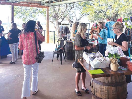 Attendees browsed the vendors at the Women in Business event at Wagon Springs Wine Room.