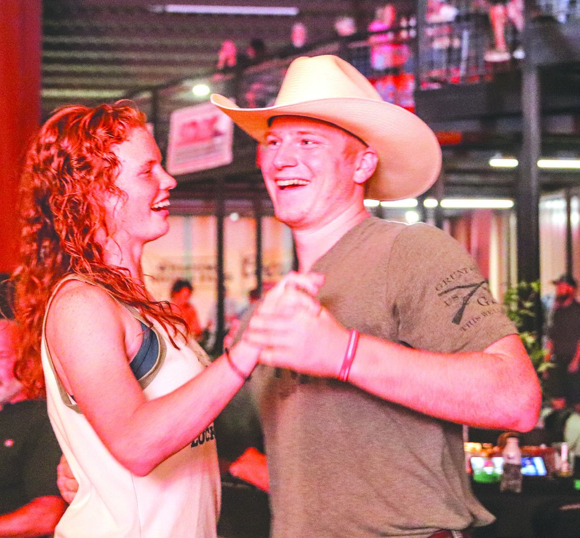Adrianna Briggs and Khris Kassner of Burnet two-stepped Sept. 21 at Putters &amp; Gutters of Marble Falls during Weakday Ministries fundraiser. Find more photos Inside. Photos by Martelle Luedecke/Luedecke Photography