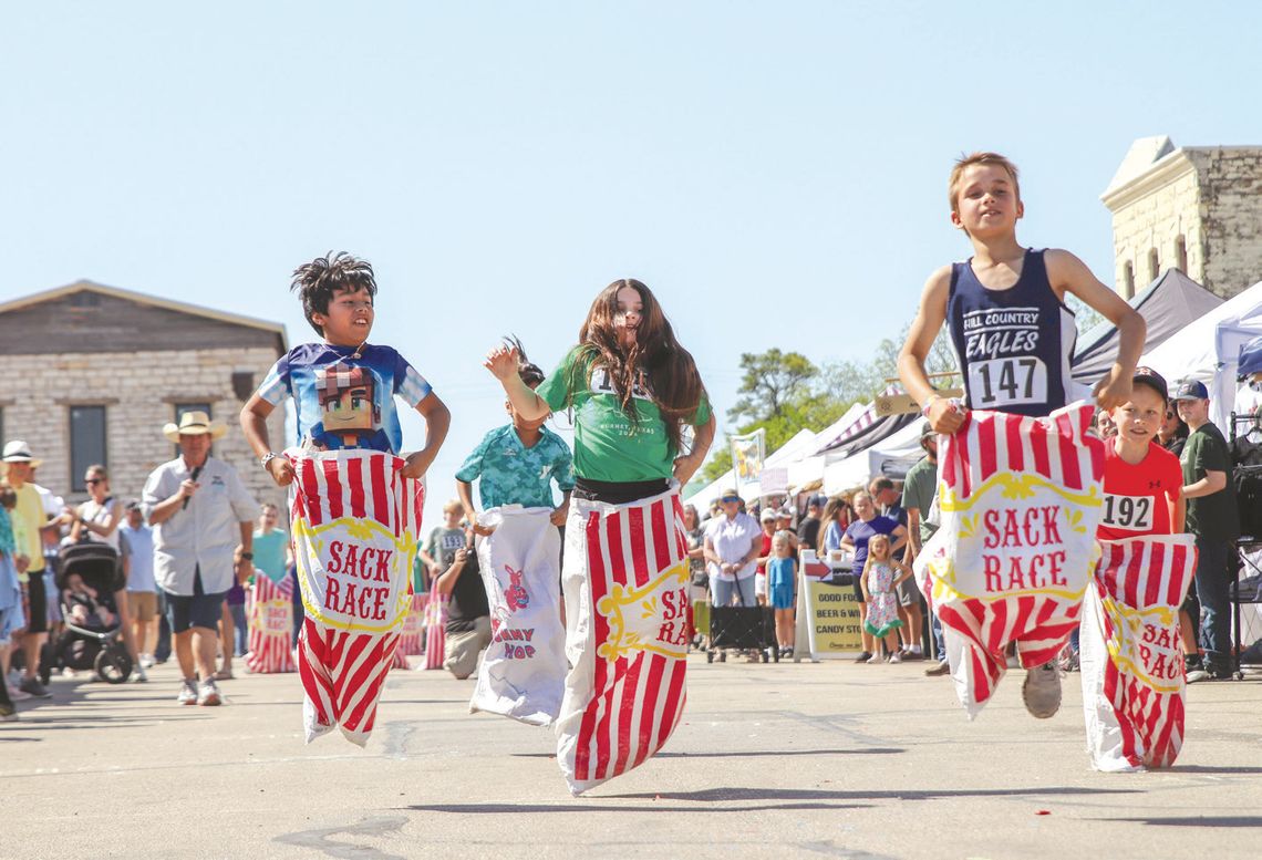 Clint Thompson led his heat of the sack race April 12 during the Children’s activities of the Bluebonnet Festival. Find more photos on Pages 12 and 14. Photos by Martelle Luedecke/Luedecke Photography