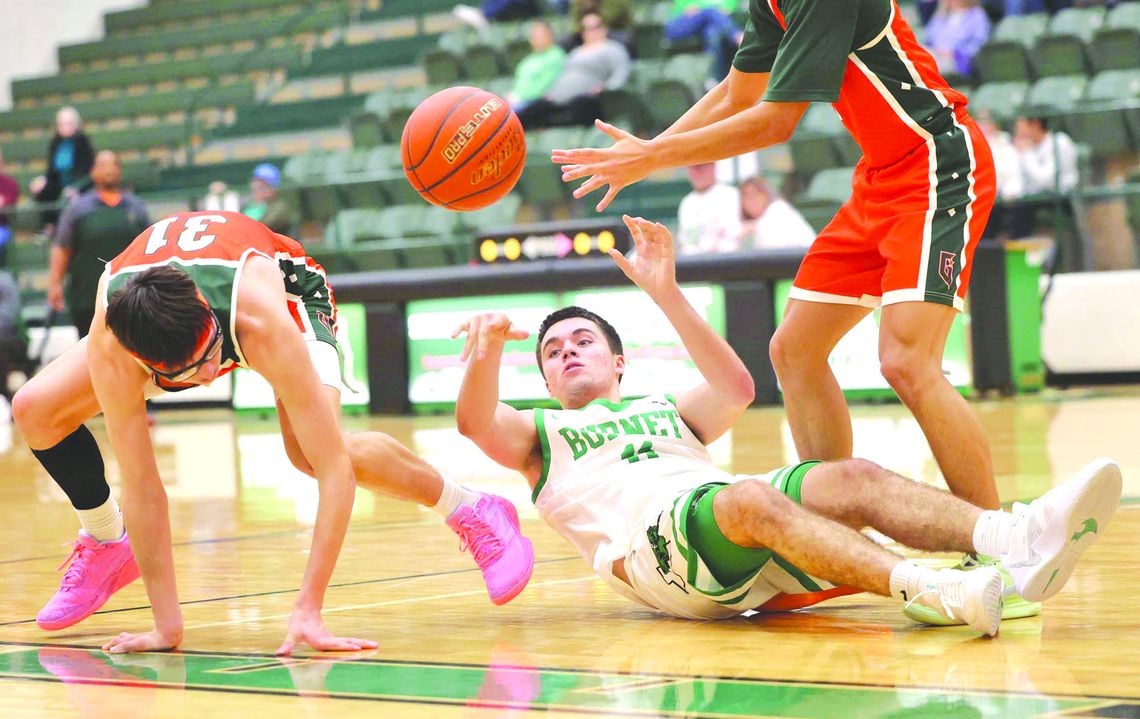 Marcus Pimentel shows some Bulldog hustle securing a loose ball and finding a teammate with a pass from his back.