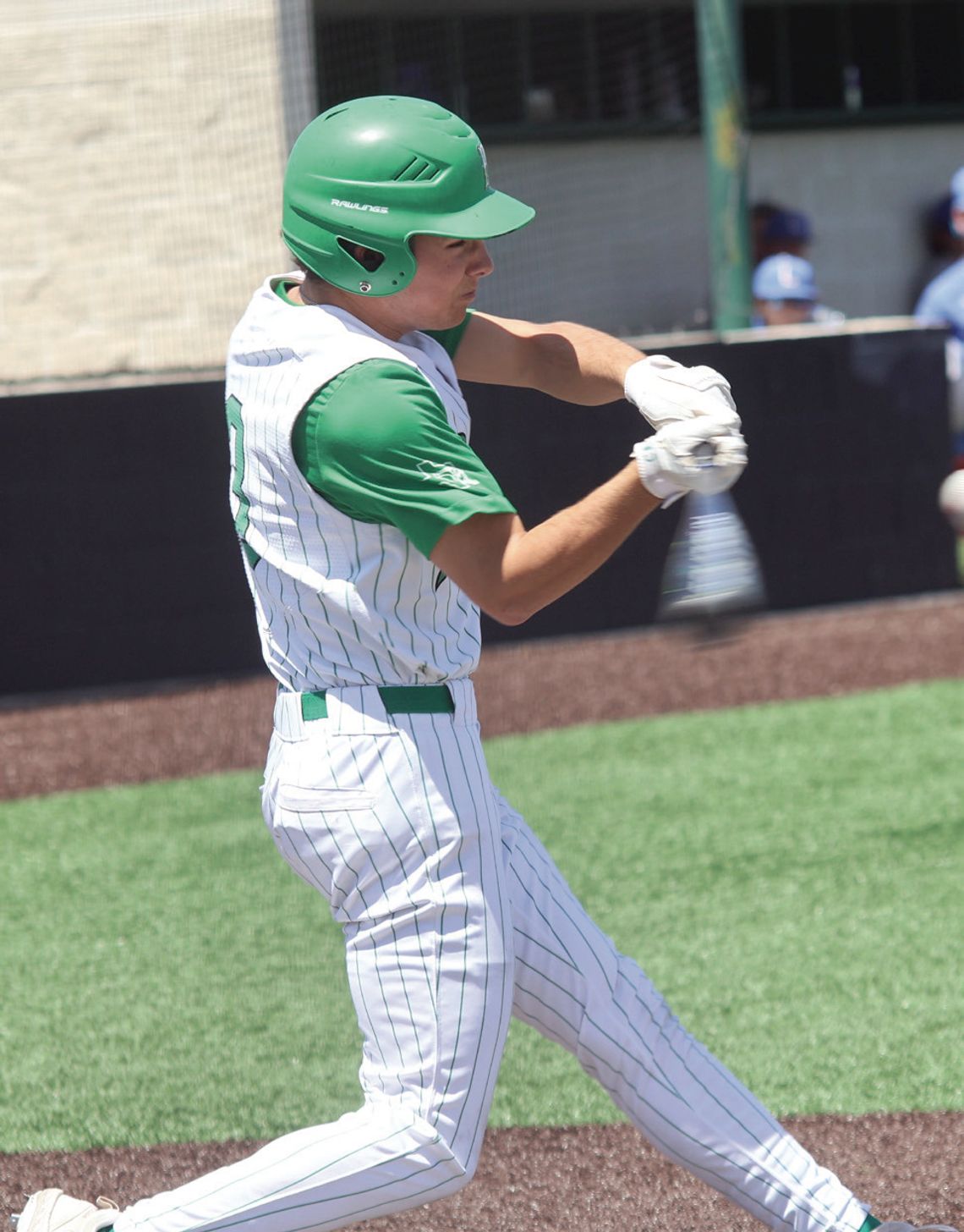 Above, Senior Cooper Alexander gets a hit against Leander to get on base. Photos by Jennifer Fierro/TexasChalkTalk.com