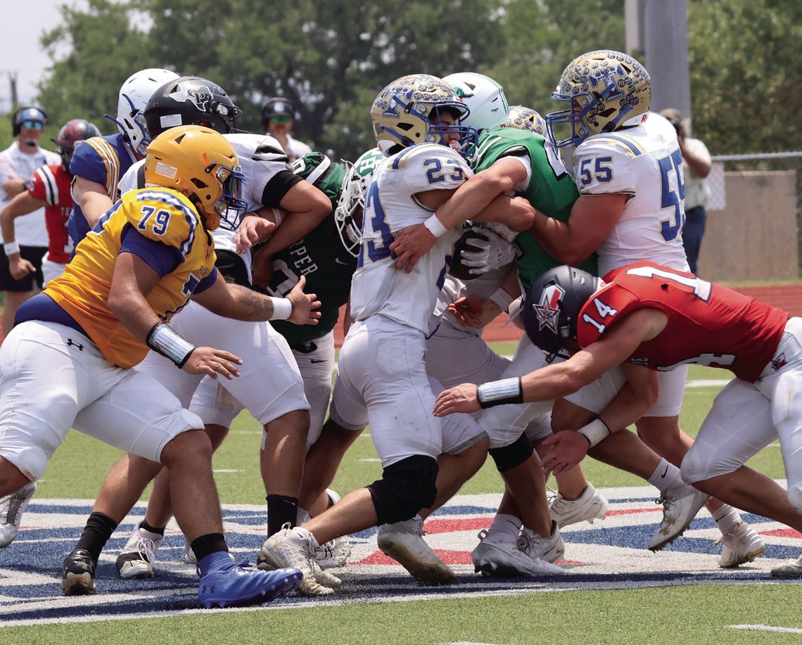 Burnet defensive end Noah Billock meets Kerrville Tivy running back Domynik Vasques at the line and pushes him back. Photos by Jennifer Fierro/TexasChalkTalk.com
