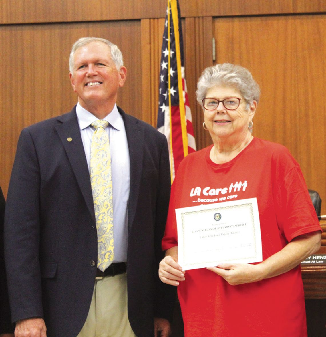 Raymond V. Whelan/Bulletin The Burnet County Commissioners Court recently congratulated the Lakes Area Food Pantry (LACare) for 40 years of service. LACare Executive Director Lottie McCorkle is pictured with Burnet County Judge Bryan Wilson.