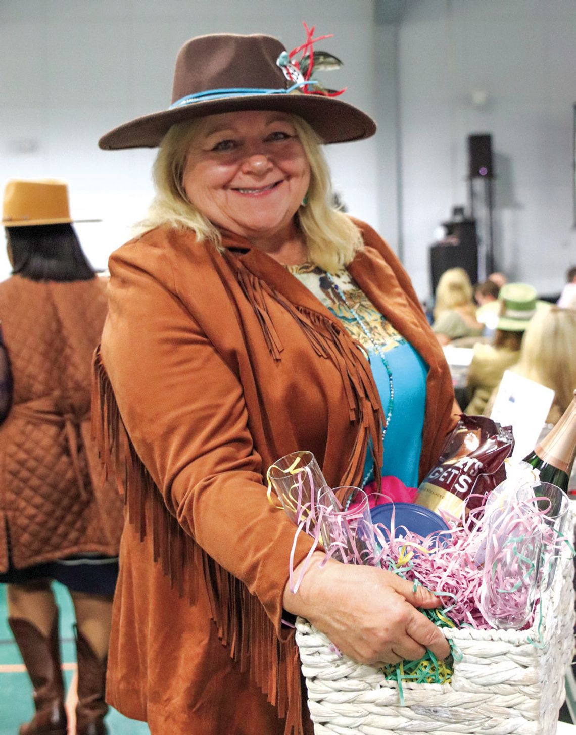 A happy Cheri Trinidad emerged as a big winner at the Highland Lakes Service League Chuck Wagon Chow Down Jan. 25 at the YMCA.