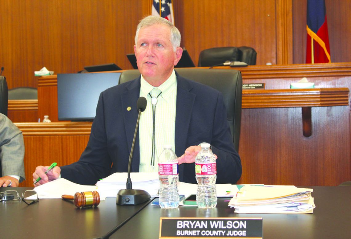 Burnet County Judge Bryan Wilson, pictured here reciting a resolution to oppose a rock quarry, presided over the May 13 commissioners court meeting. Raymond V. Whelan/Bulletin