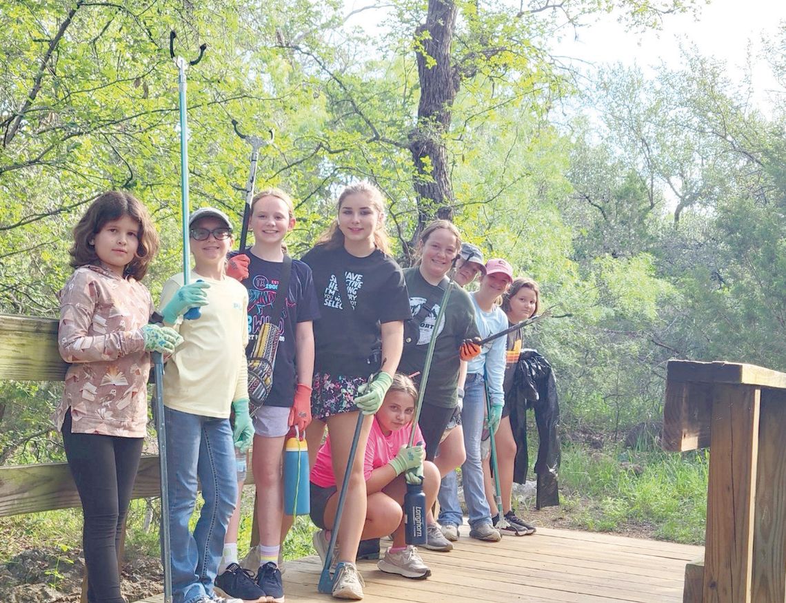 Girl Scouts clean flood-damaged areas