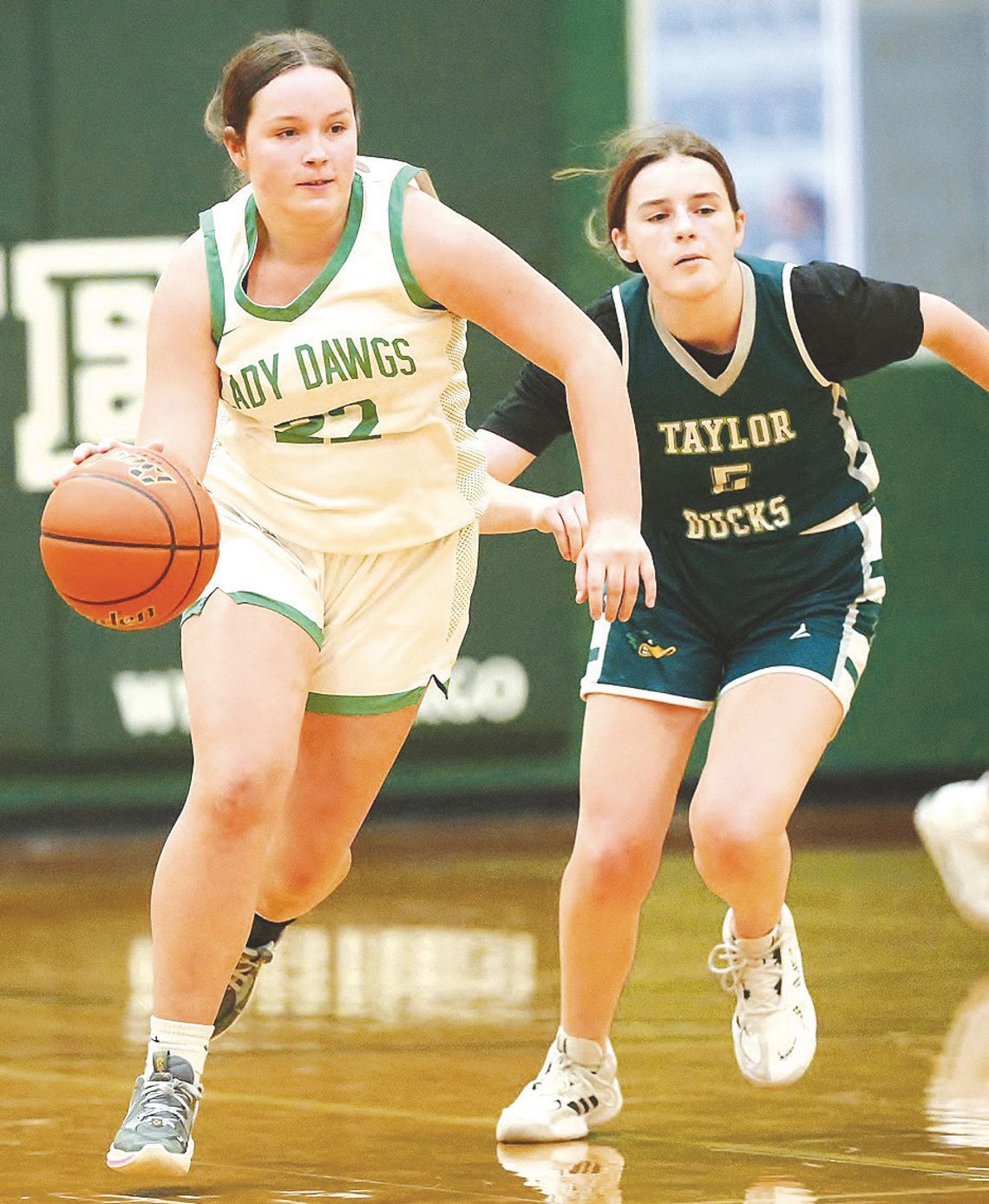 JV Lady Bulldog Landri Lewis races away from a Taylor defender after she swiped the ball away for a Burnet steal.