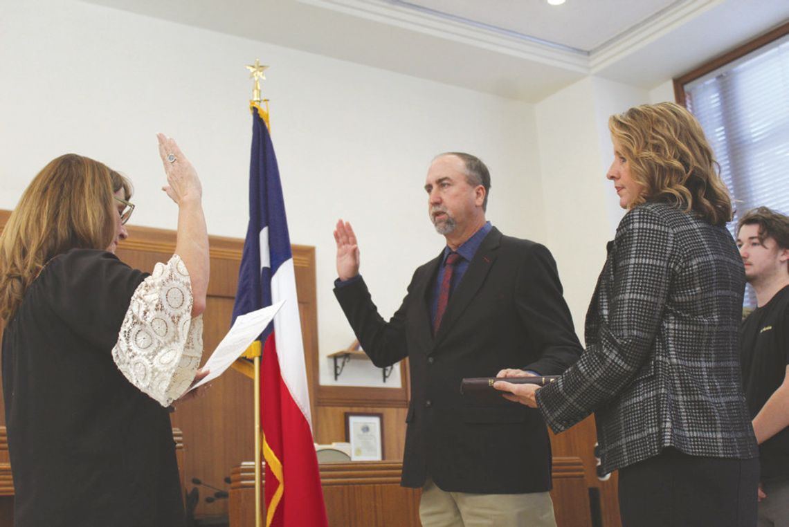 From left, Pct. 2 Justice of the Peace Lisa Whitehead provided the oath protocol for newly elected Pct. 3 Burnet County Commissioner Chad Collier next to his wife Lyndy and son Case. Raymond V. Whelan/Bulletin