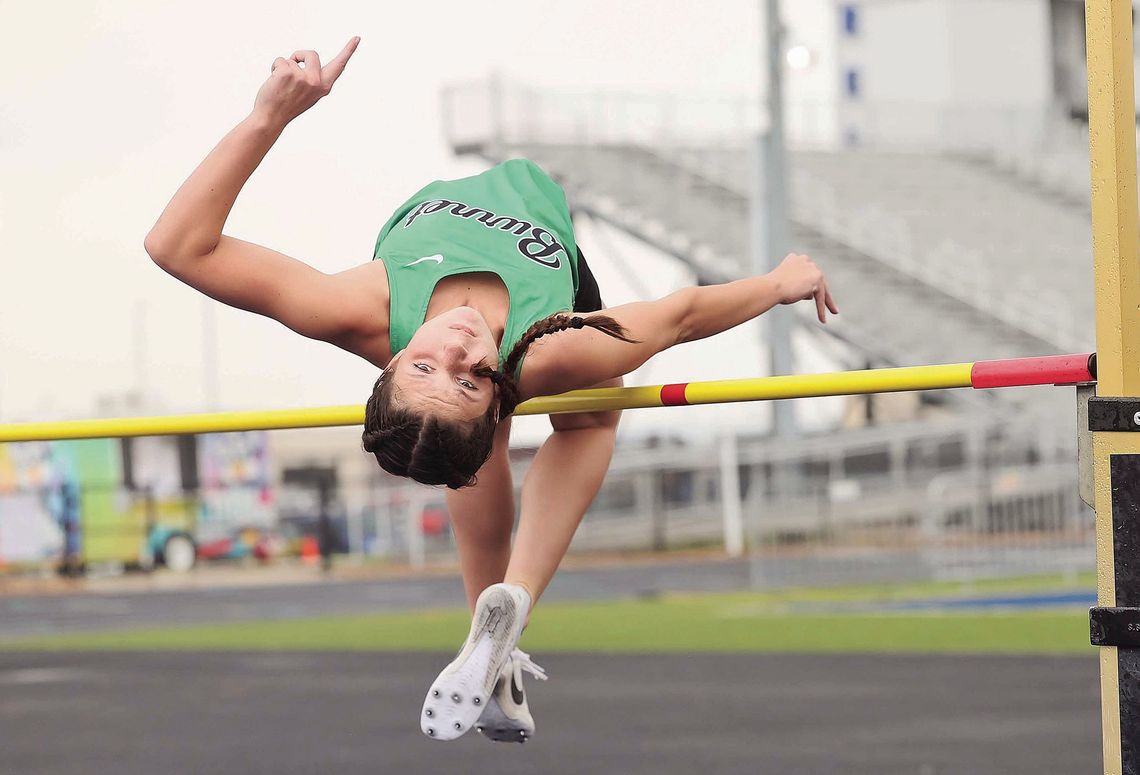 JV Lady Dawg high jumper Brooklynn Dawes clears 4’10 to win a district championship at Wednesday’s 24-4A Meet in Jarrell. Photos by Wayne Craig/Clear Memories
