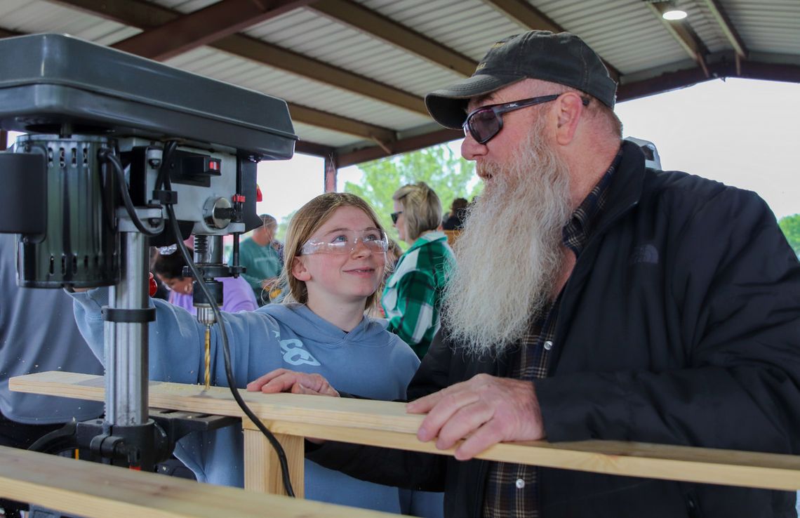 Each year, the Burnet Rotary Club plays a big part in the bed build operation, hosted by Sleep in Heavenly Peace. Pictured is Addy Parker and Chris Parker at the bed build last spring at Wallace Riddell Park. File photo