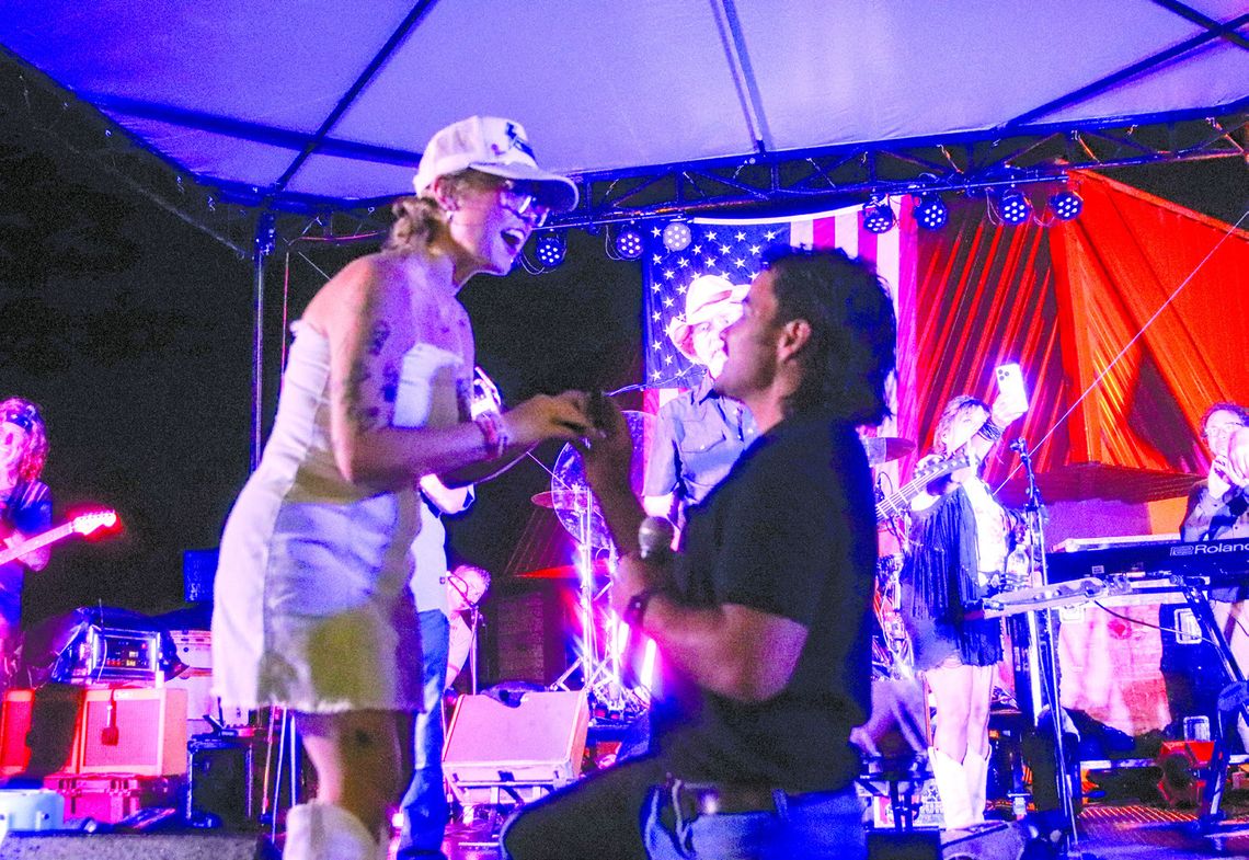 Photos by Martelle Luedecke/Luedecke Photography On Saturday July 6, during the Jackson Street Jams Bellamy Brothers concert, Burnet resident Parker Robertson got down on one knee and proposed to Kenze Jones.