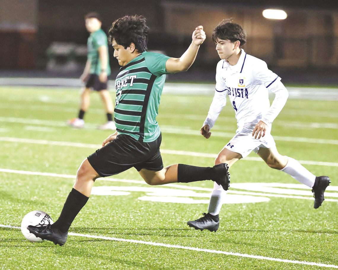 Burnet junior, Samuel Rodriguez gets some separation from a Lago Vista defender and sends the ball downfield for Burnet. The Bulldogs won the match, 5-1.