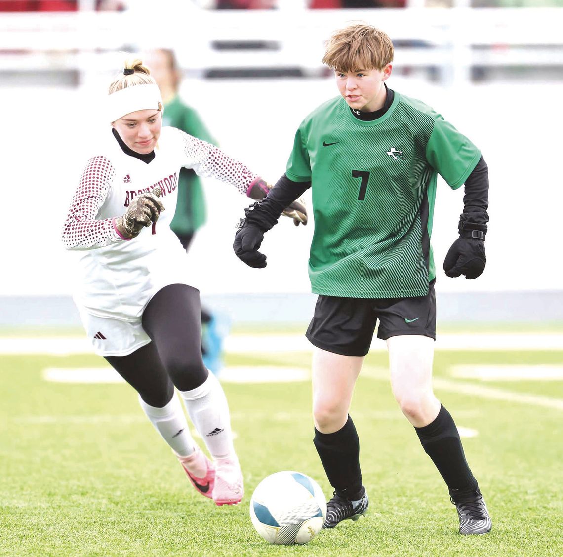 Lily Ralph (7) looks to pass the ball up-field during an exciting contest versus Brownwood that took PKs to decide. Burnet advanced all the way to the semifinals at their host tournament over the weekend. District starts this week.