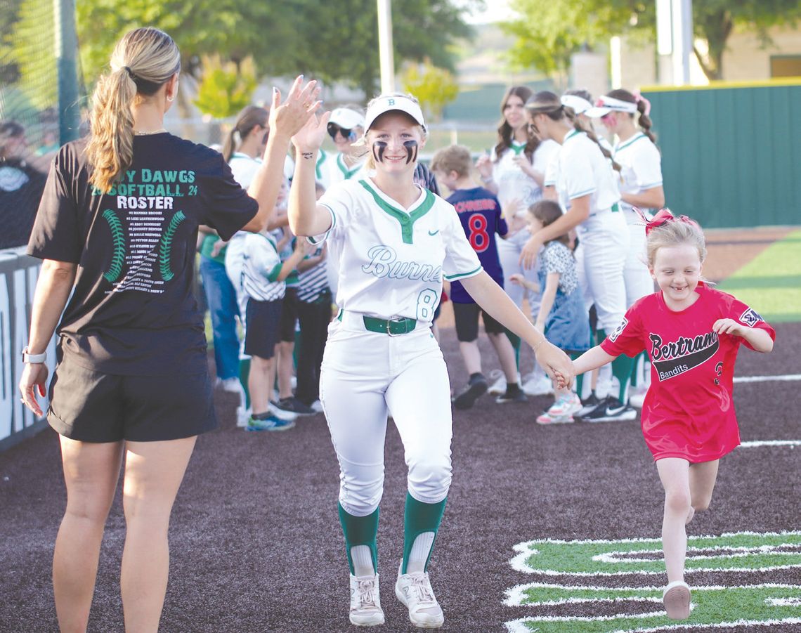 Softball Senior Night Lady Dawg Halle Maxwell and a Bertram Little League player high fived Coach Ali Tippie at Burnet High School senior softball night April 15. Find more photos on Page 7. Martelle Ludecke/Luedecke Photography