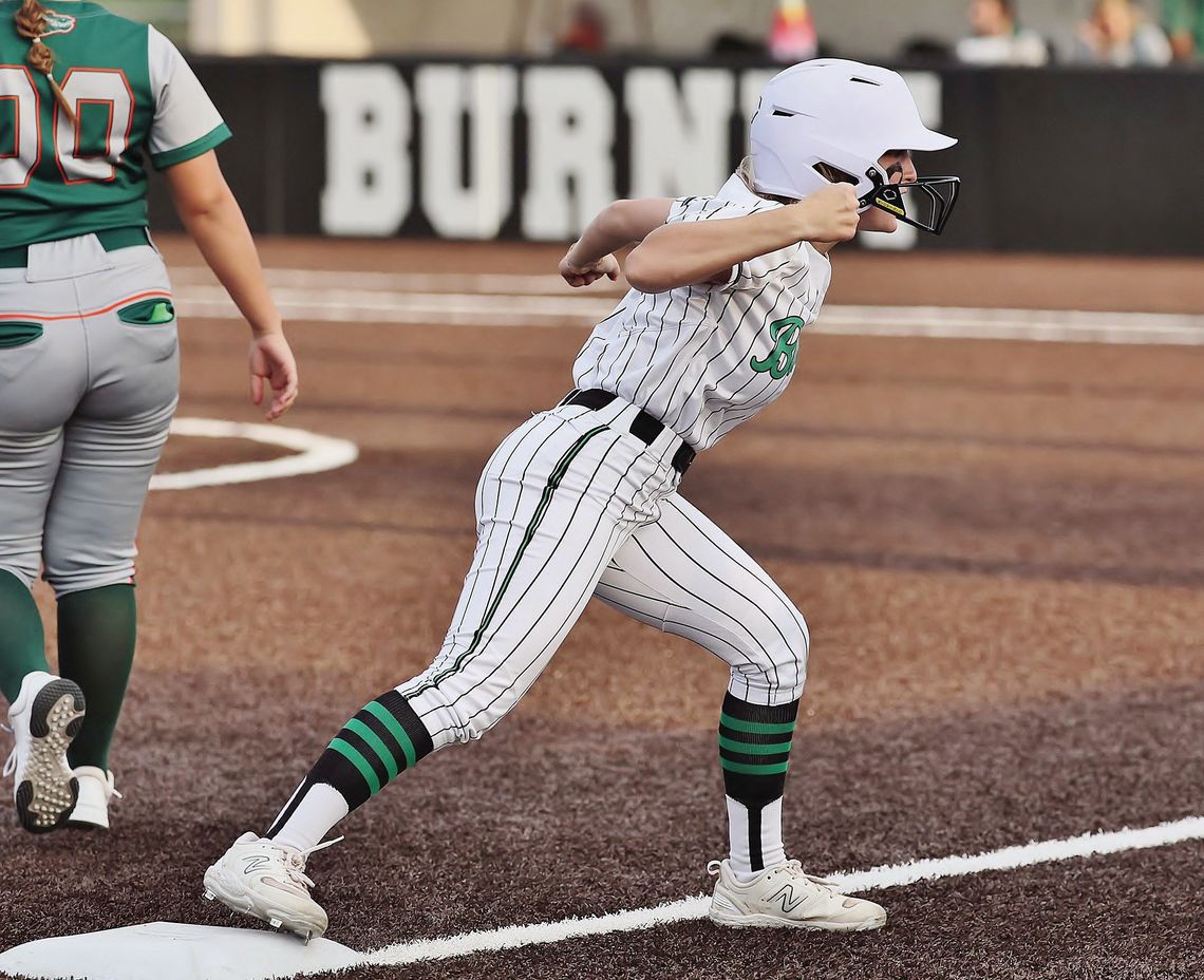 Varsity Lady Dawg Halle Maxwell celebrates a hard hit triple in the bottom of the seventh with her coach and teammates. The hit was oh so close to a walk off homerun versus state ranked Gateway but fell just shy. Photos by Wayne Craig/Clear Memories