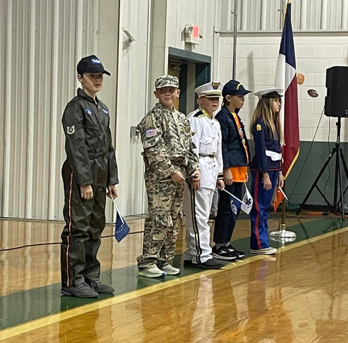 Students honor service members and veterans Pictured, from left, are BCISD students Rory Blasienz, Easton Floyd, Aiden Brownlee, Zane Munger and Brooke Kiley, who represented members of the armed forces at the Veterans Day program.