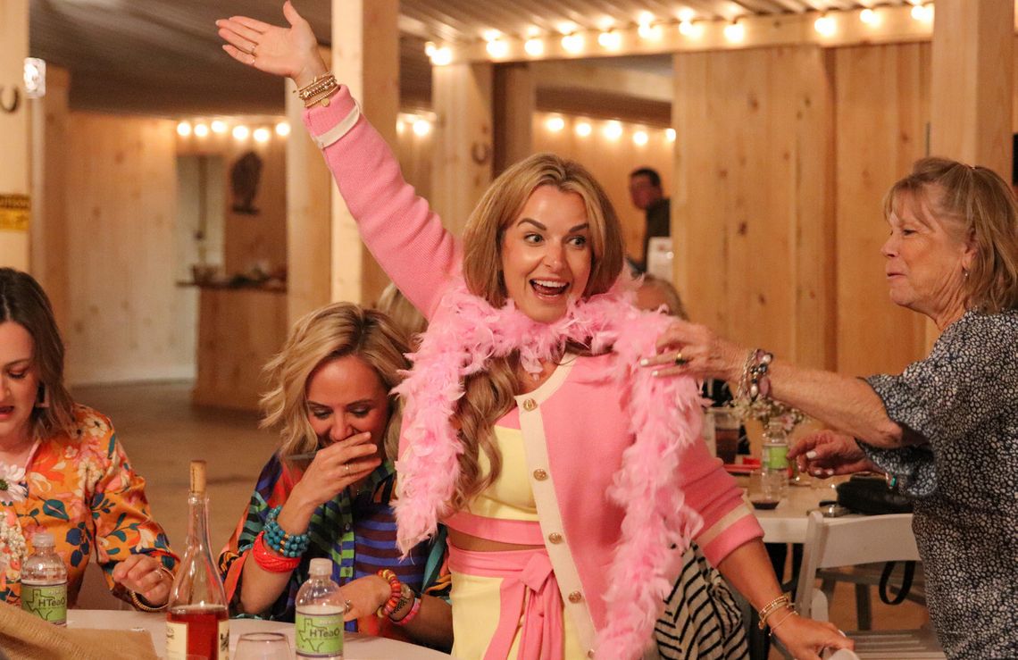 Photos by Martelle Luedecke/Luedecke Photography Casey Current temporarily wore a pink boa Bunco winner prize Feb. 26 during Bunco for Babies at Wagon Springs Ranch.