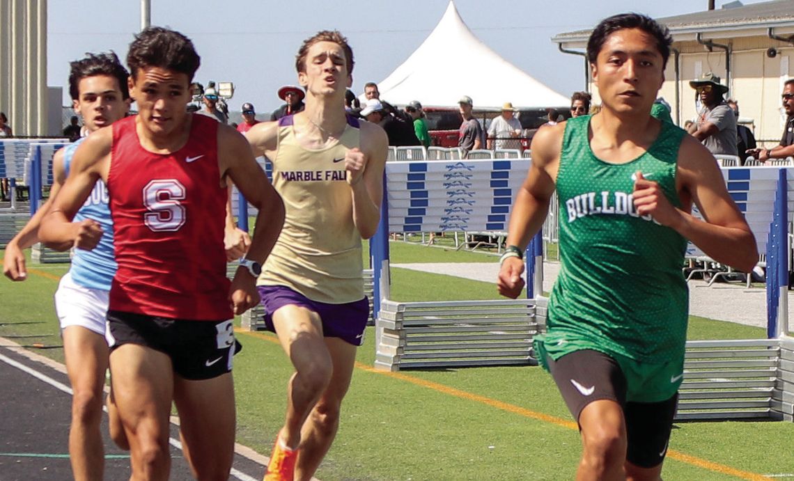 Above, Burnet senior Victor Aviles shows no signs of distress as he cruises through the finish line of the 800 meters.
