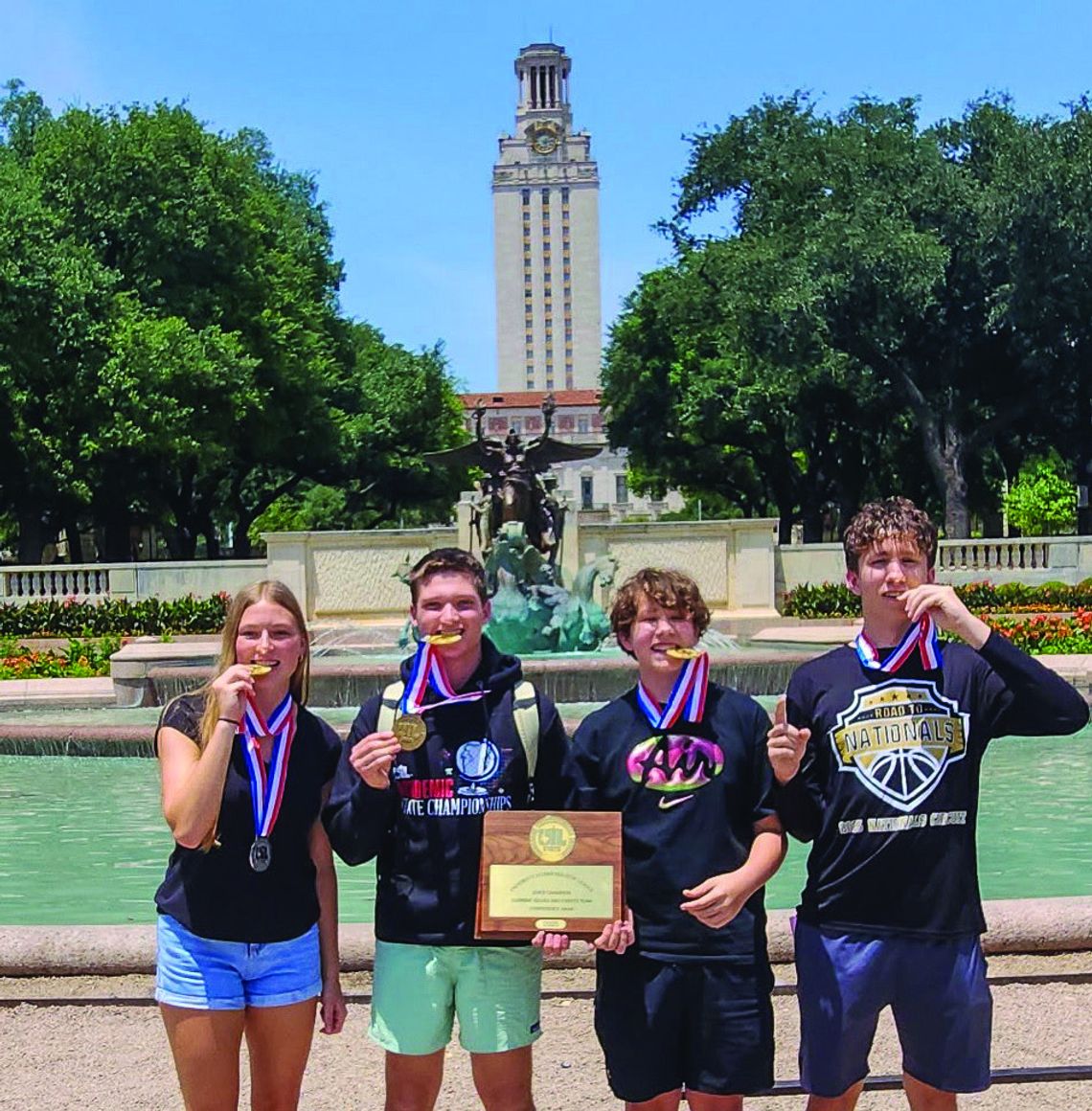 Wrigley Mulhollan, Alex Davis, Braven Briant and Maddox Briant for the iconic gold championship photo in front of the University of Texas Tower.